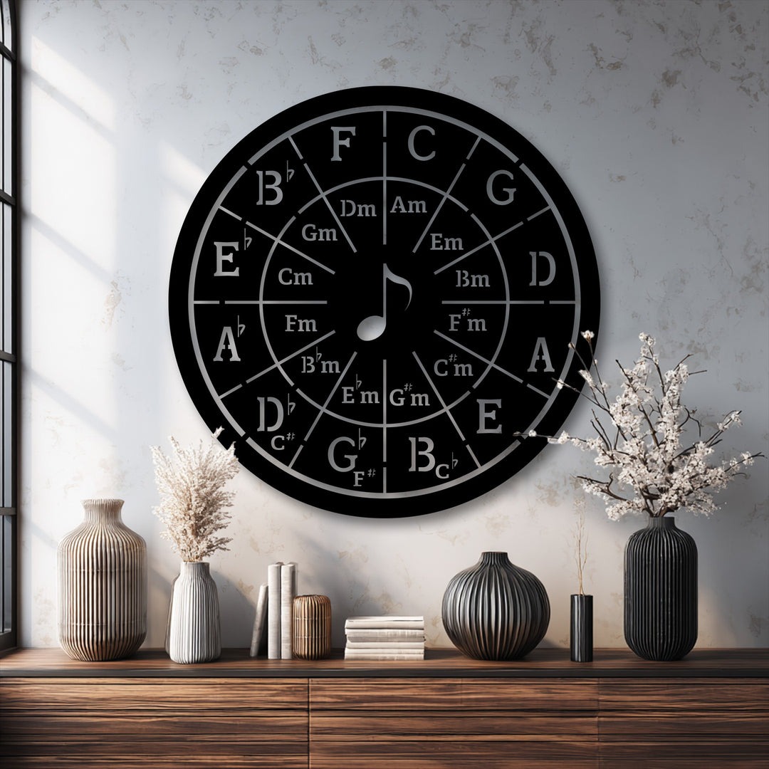 Sunlight and shadow elegantly reveal the intricate design of the unique metal wall art Circle of Fifths music theory decor on a textured wall.