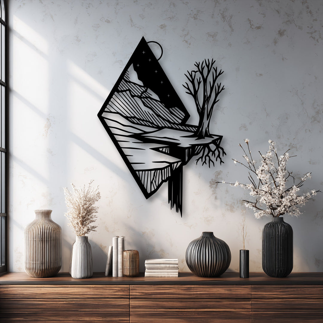Strong color contrast highlights the black unique metal wall art of a floating mountain and tree against a bright textured wall.