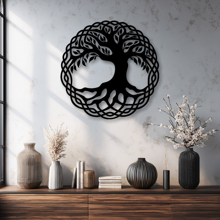 The intricate interwoven edges and circular borders of the black Celtic Tree of Life metal wall decor frame the symbolic nature art.