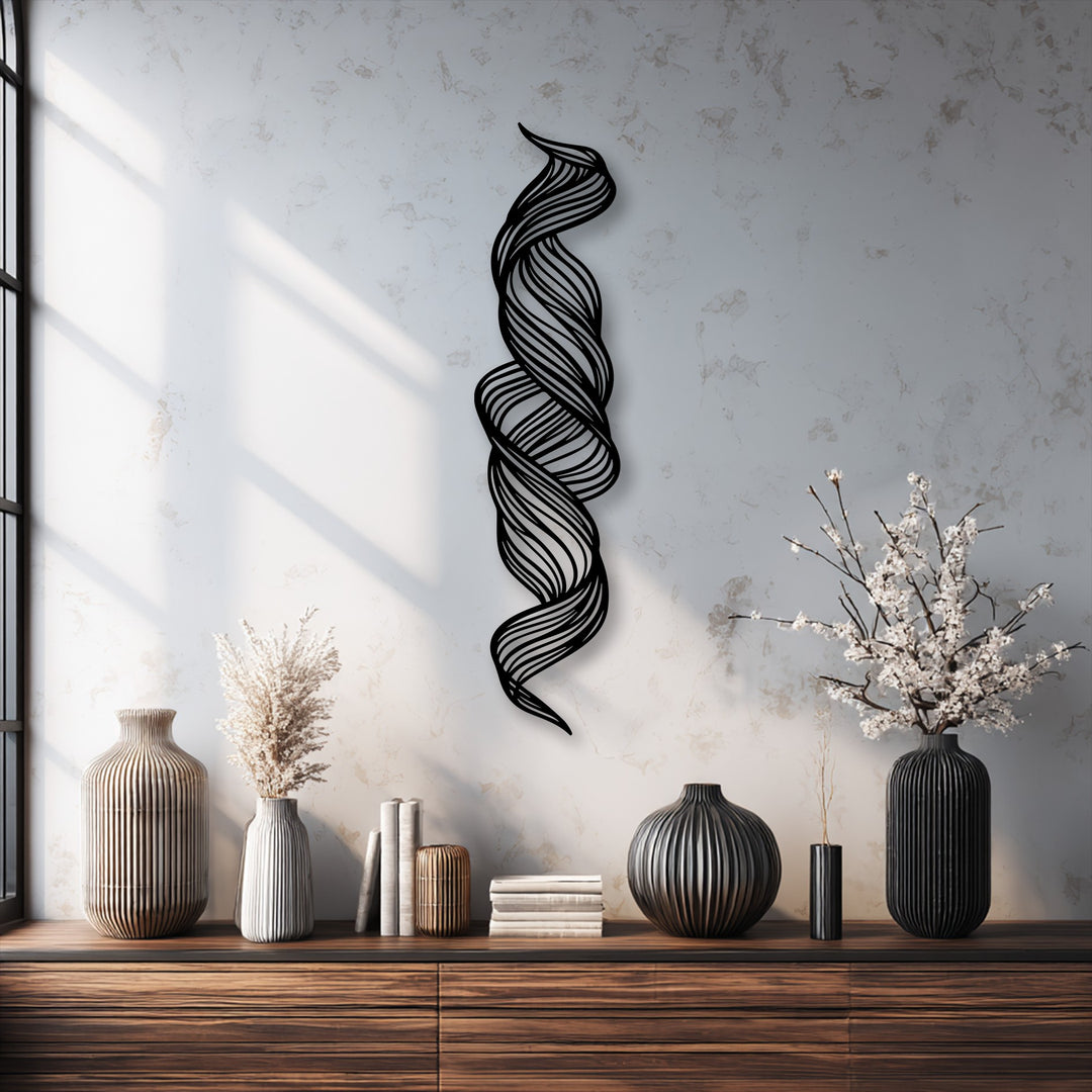 The sleek, dark borders of the twisted flow abstract metal wall decor create a striking vertical silhouette against the light wall.