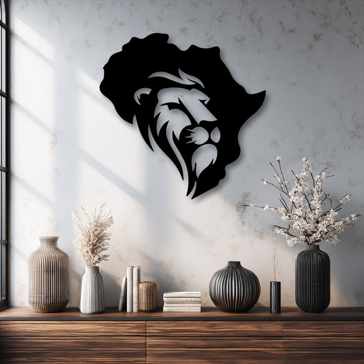 Bold black metal artwork featuring a striking lion's head within the continent of Africa map design on a light wall.