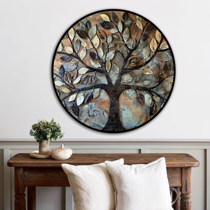 Encircling the rustic oil painting home decor, the black edge defines the round, textured metal leaf tree art piece, enhancing its decorative border on the wall.