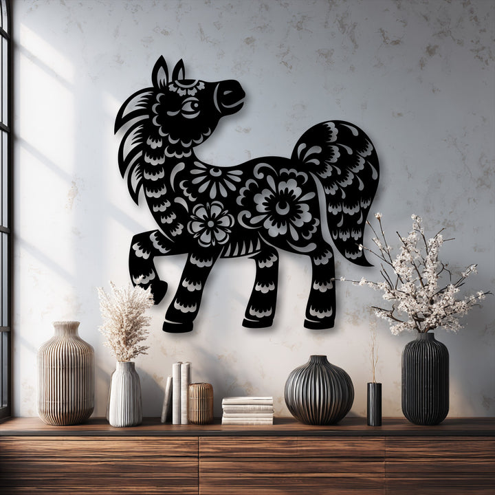 Focusing on the transition between colors, a dark floral pony metal wall decor silhouette starkly contrasts with the light, textured wall.