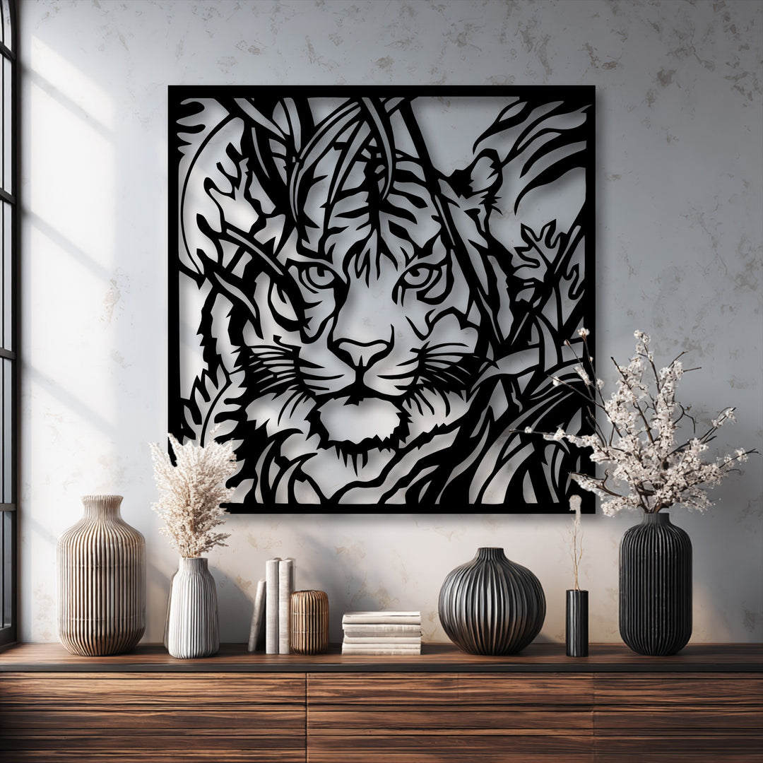 The rough, textured wall provides a striking backdrop for the smooth, intricate lines of the unique metal wall art featuring a tiger in foliage.