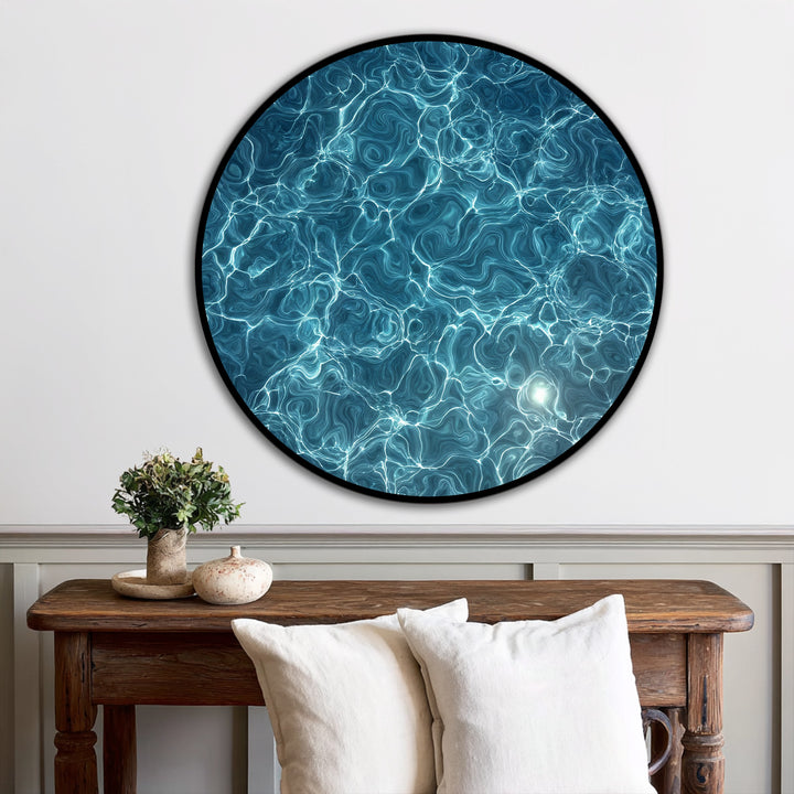 Aqueous mood conveyed in this round oil painting wall art through the luminous water texture and dynamic turquoise currents creates a calming, abstract effect.