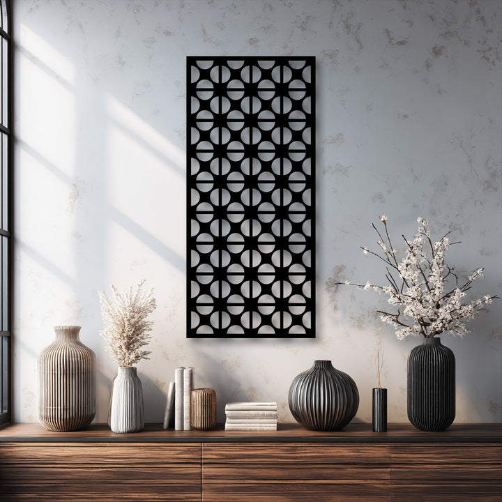A vertically oriented rectangular metal art for wall panel showcases a modern geometric circle pattern, adding a minimalist aesthetic to the space.