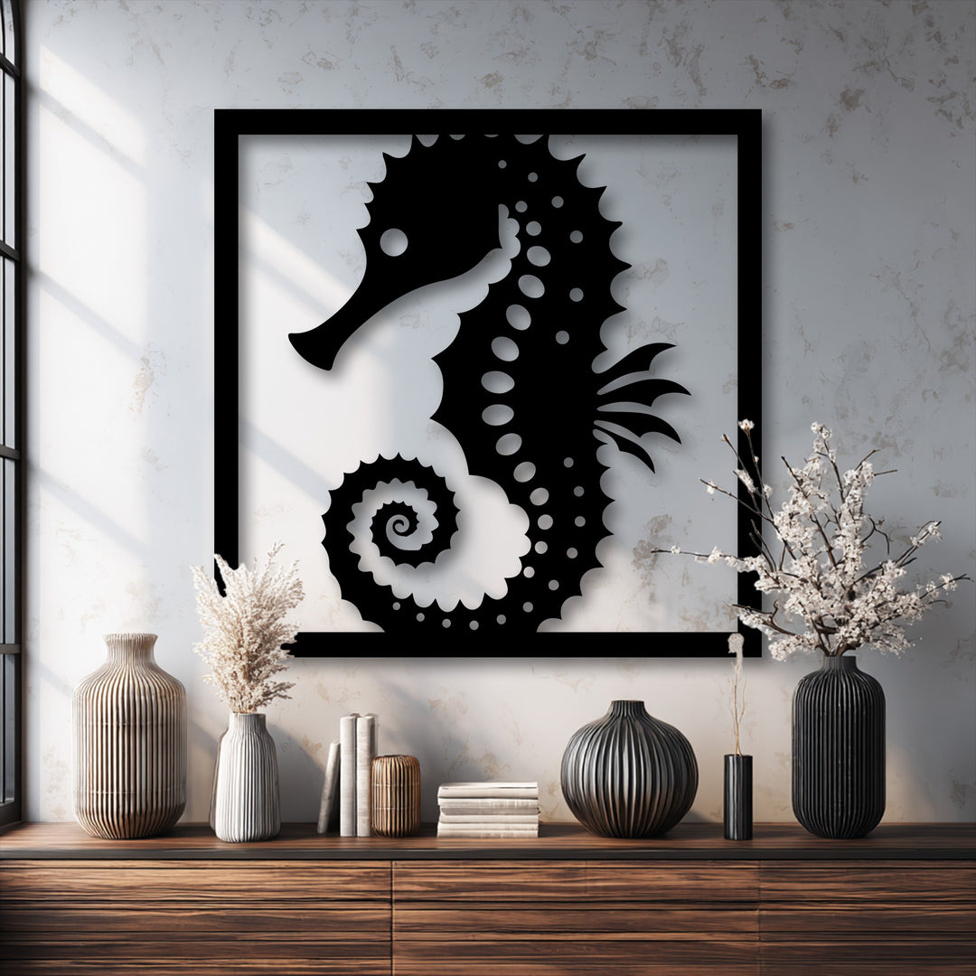The stillness of a serene room is captured by the black framed seahorse metal decoration wall art, surrounded by elegant vases and books.