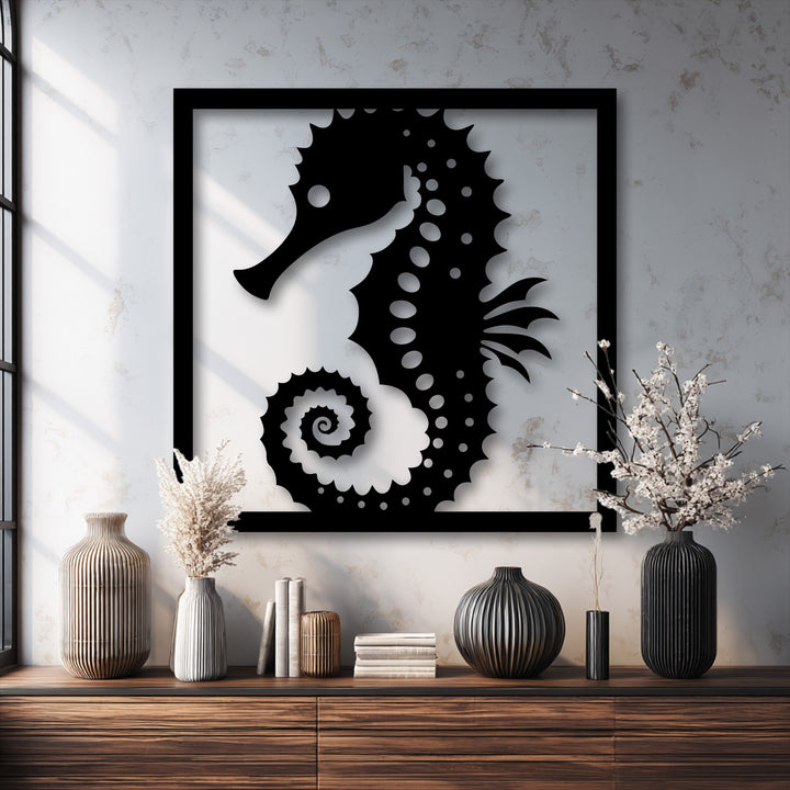 The stillness of a serene room is captured by the black framed seahorse metal decoration wall art, surrounded by elegant vases and books.