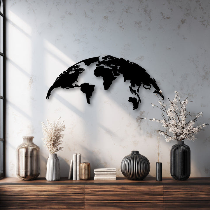The brightly lit wall area, with striking window shadows, elegantly displays the minimalist World Map metal artwork, offering modern global silhouette decor.