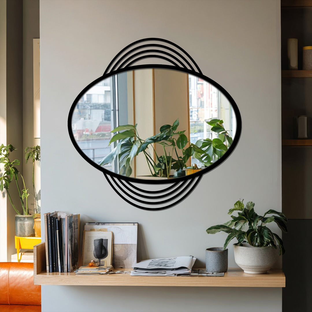 Black metal framed oval mirror