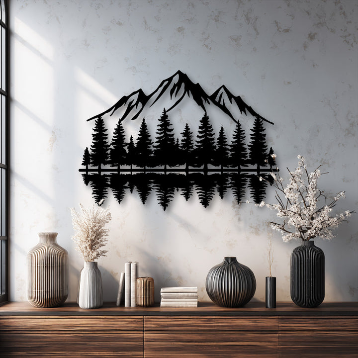 Focusing on depth and layers, this captivating metal artwork features intricate mountain and forest silhouettes with a mirrored reflection, creating striking visual depth.