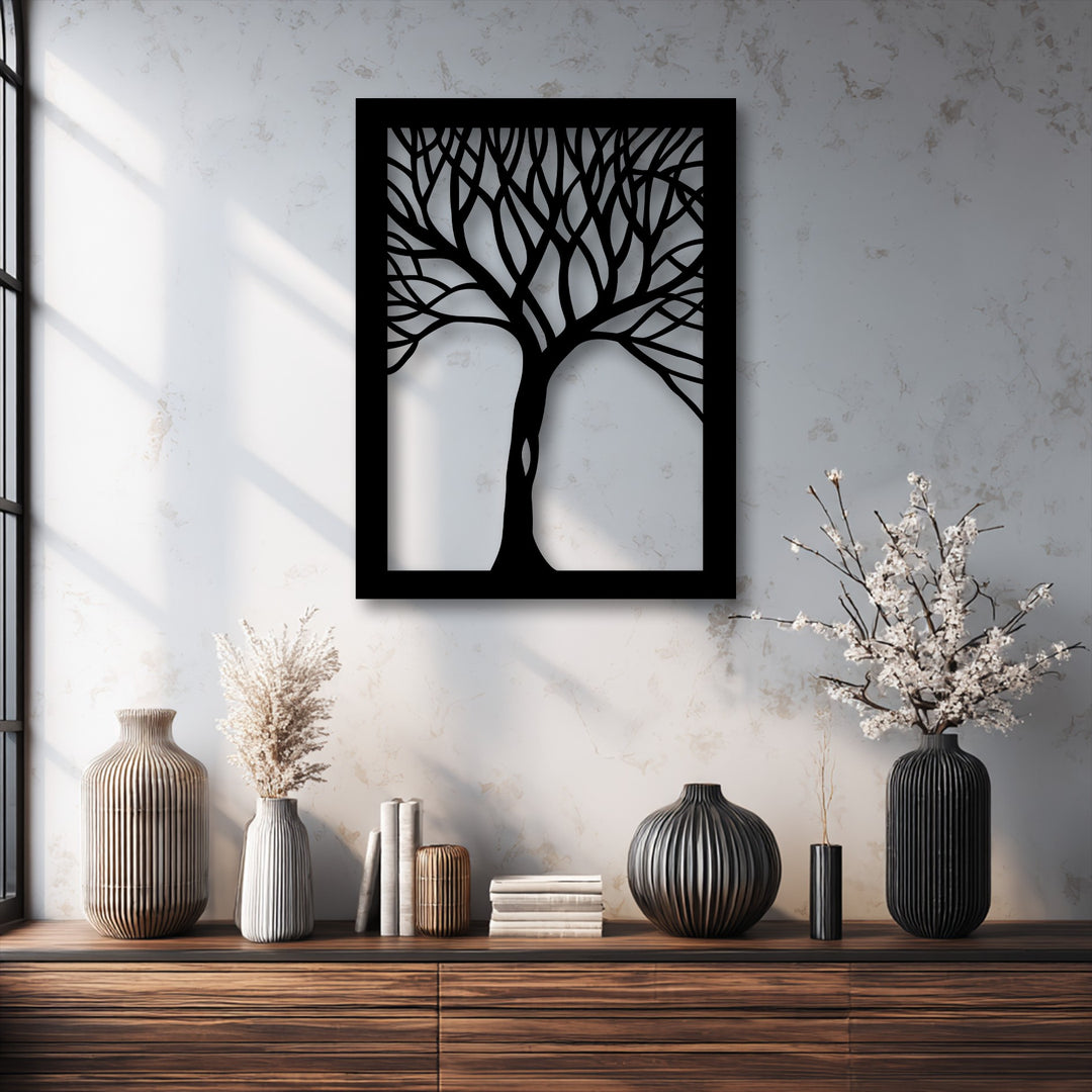 The prominent black frame and defined borders of the abstract tree silhouette create striking metal art for wall decor.