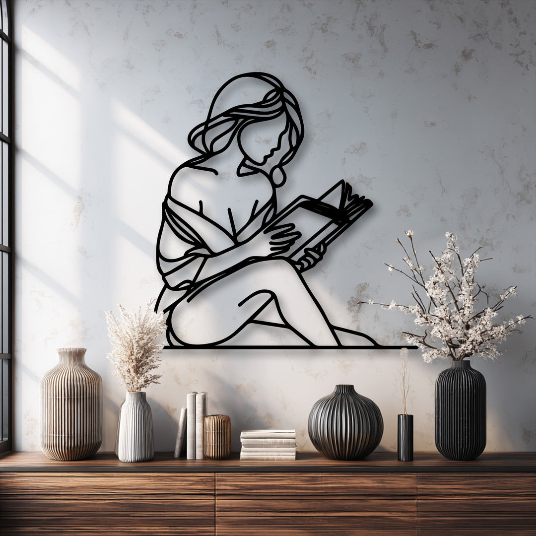 The brightest area of the image features a white wall with sunlit patterns, providing a stark backdrop for the elegant quiet reader silhouette metal art for wall.