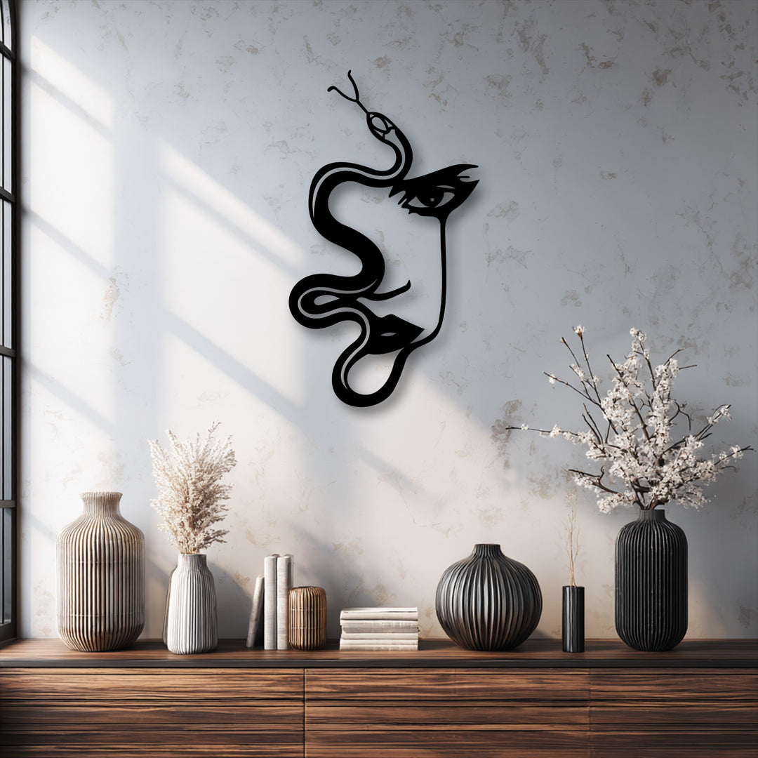 The abstract quality of the decorative metal art is highlighted in this striking woman and serpent silhouette.