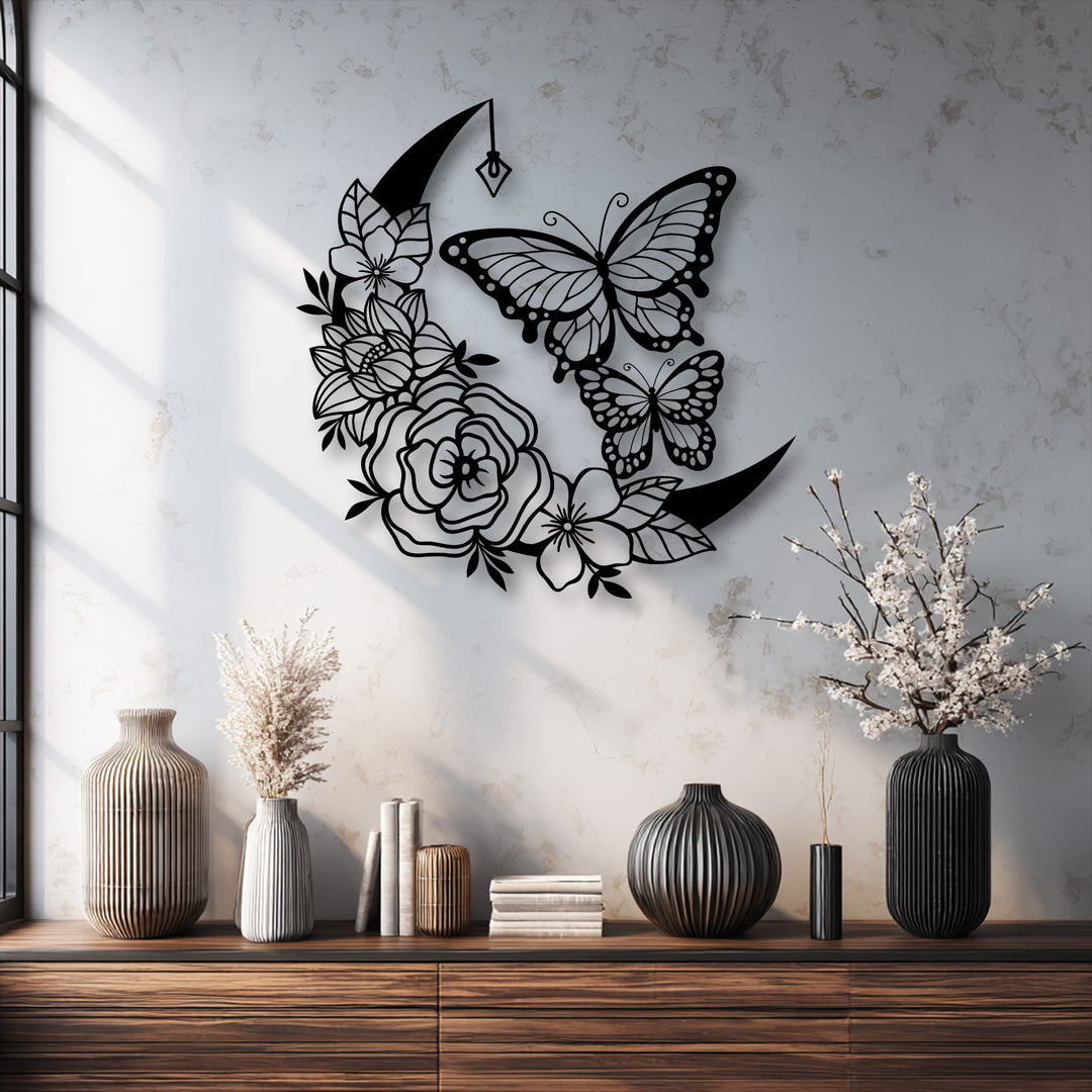 The visual rhythm of the intricate metal moon and butterfly decoration wall art is echoed by the repeating vertical lines of the vases below.