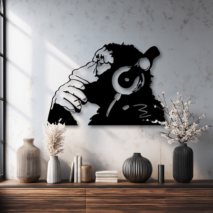 Rough wall, ribbed vases, and smooth metal monkey headphones decoration wall art create a study in contrasting surface textures.