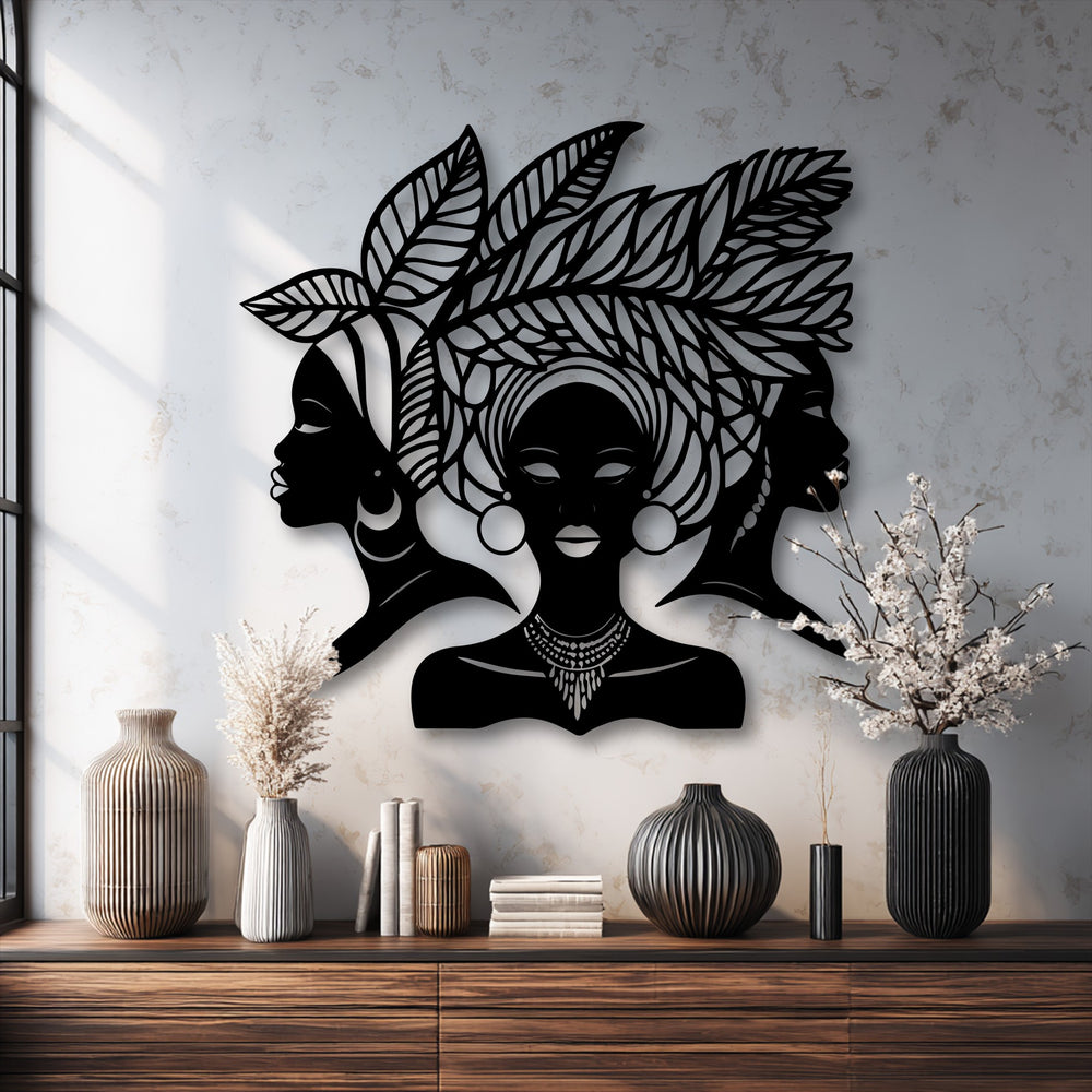 The metal wall decor showcases an intricate African women silhouette with a pronounced layering effect, creating depth against the textured background.