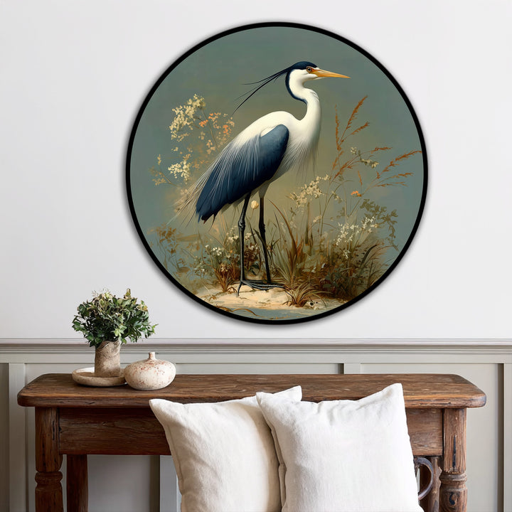 Showcasing the realistic detail, this round modern oil painting art depicts a heron standing amidst grassy foliage, creating a stunning focal point for nature-inspired decor.