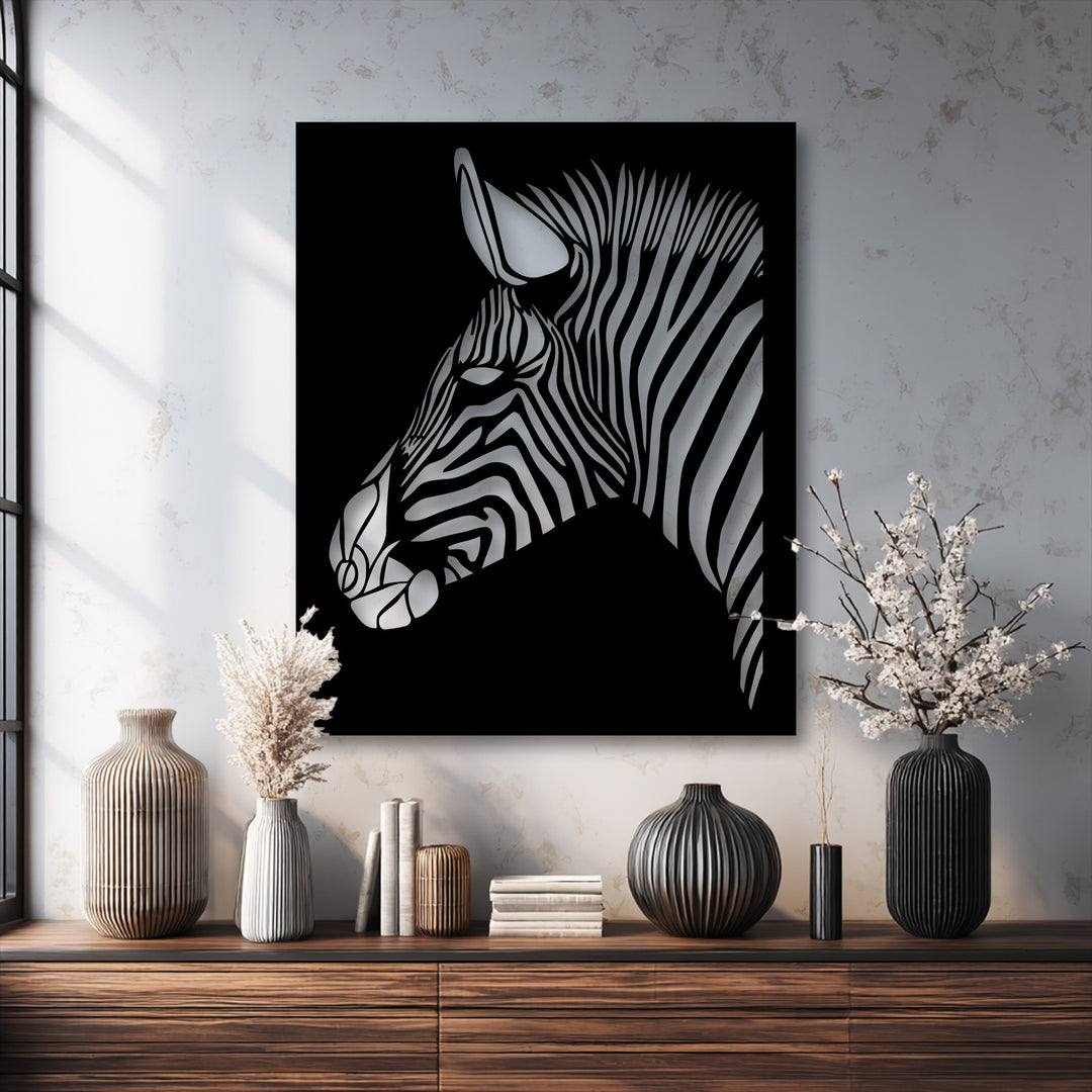 Light and shadow dramatically emphasize the geometric stripes of a zebra head in this striking decorative metal art.