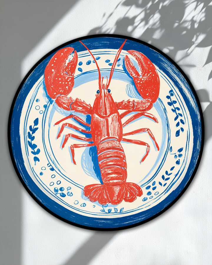 Framed with a thick black border and an inner band of coastal blue, this unique canvas print showcases a stylish plate design featuring a lobster.