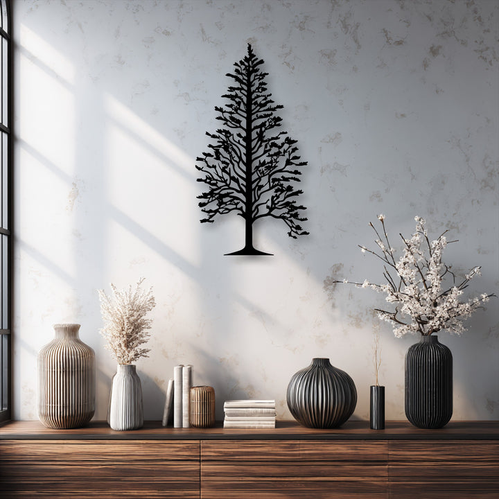 Strong color contrast defines the black Majestic Pine Tree Silhouette Metal Wall Art against the light, textured wall, presenting captivating decorative metal art.