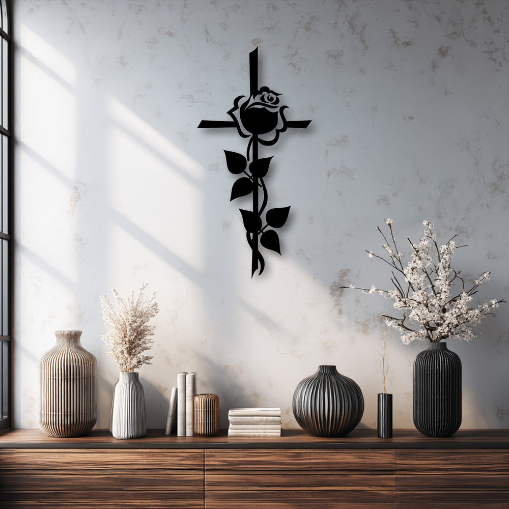 The sleek, defined edges of the black rose cross silhouette metal artwork create a striking spiritual floral form.