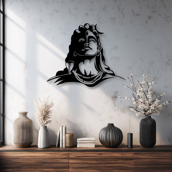 A rich wooden console table in the foreground displays textured vases and books, elegantly framing the spiritual Lord Shiva decorative metal art.
