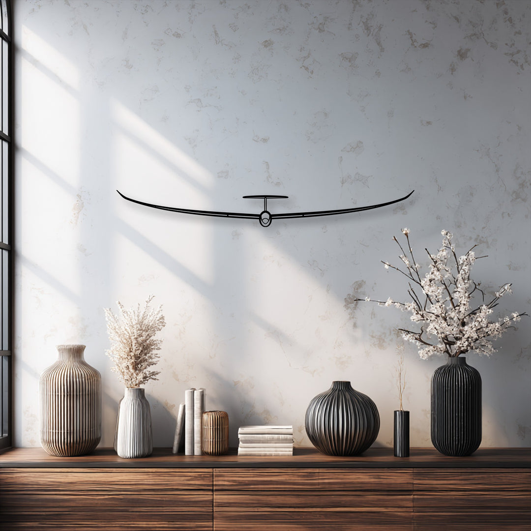 The dominant off-white background highlights the sleek decorative metal art of a minimalist glider.
