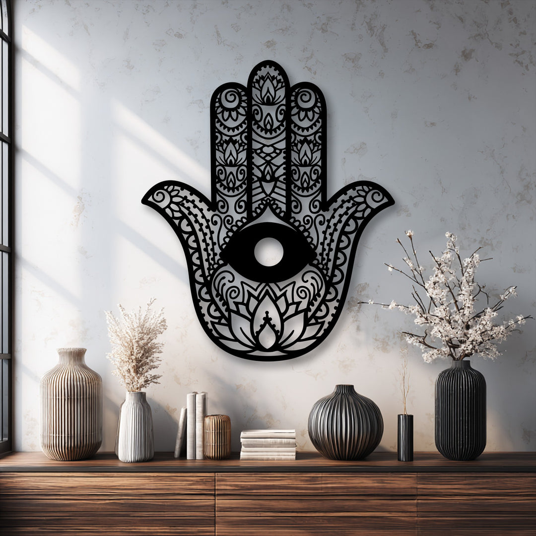 A bright, warm-toned color temperature with crisp shadows enhances the black Hamsa Hand Metal Wall Art, a detailed metal wall decor.