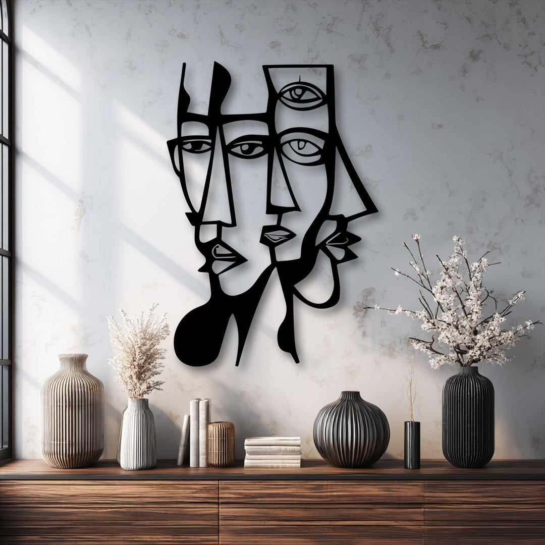 The realistic detail of the striking black metal art for wall showcases abstract dual faces with sharp geometric lines and distinct shadow play.