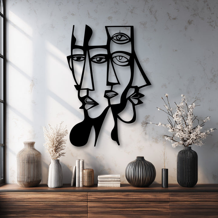 The realistic detail of the striking black metal art for wall showcases abstract dual faces with sharp geometric lines and distinct shadow play.