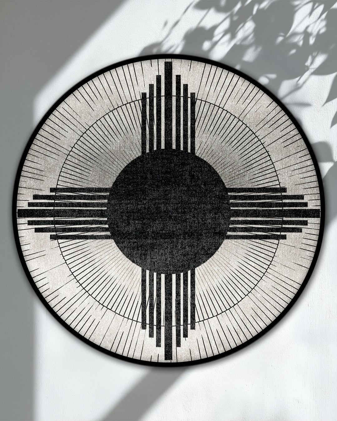 Cool color temperature emphasizes the monochrome tones of this modern geometric sunburst circle abstract hanging canvas print, creating minimalist wall art.