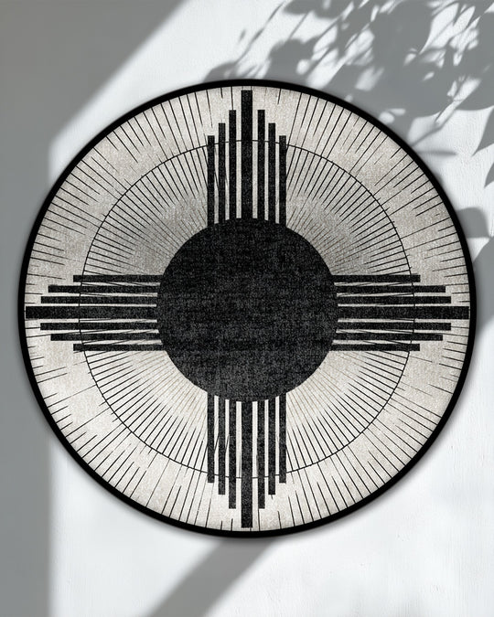 Cool color temperature emphasizes the monochrome tones of this modern geometric sunburst circle abstract hanging canvas print, creating minimalist wall art.