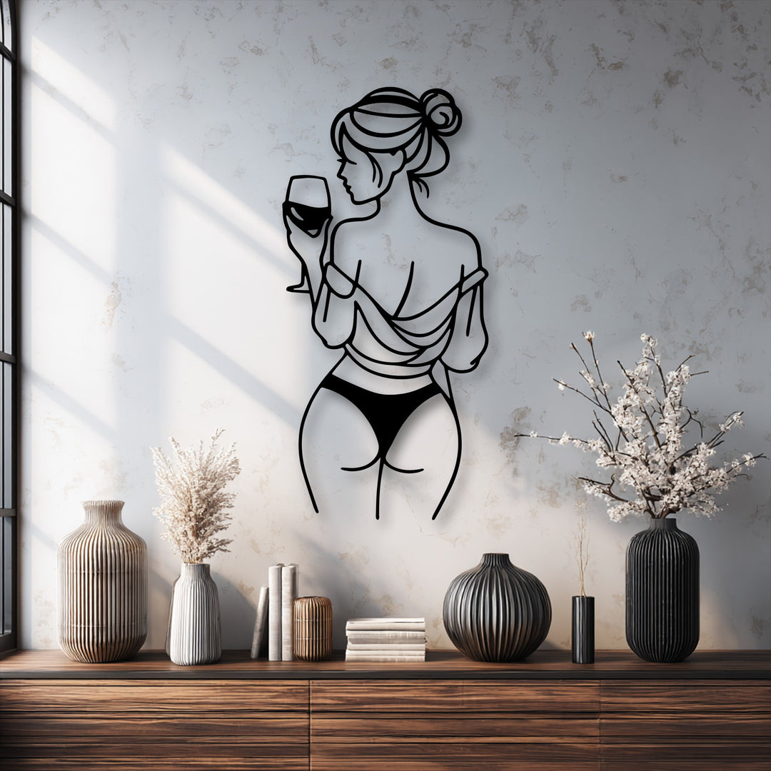 Visual rhythm emphasizes the sleek lines of the wine lady metal artwork, gracefully contrasting with textured wall and ribbed vases.