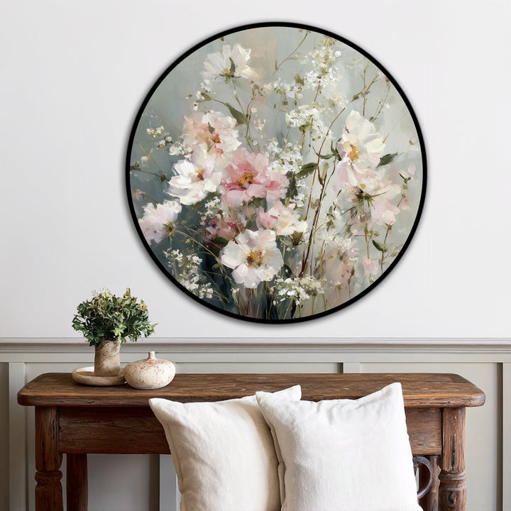 Soft, muted gray and beige hues create an ethereal backdrop for this round oil painting wall art, enhancing the delicate pastel wildflowers in bloom.