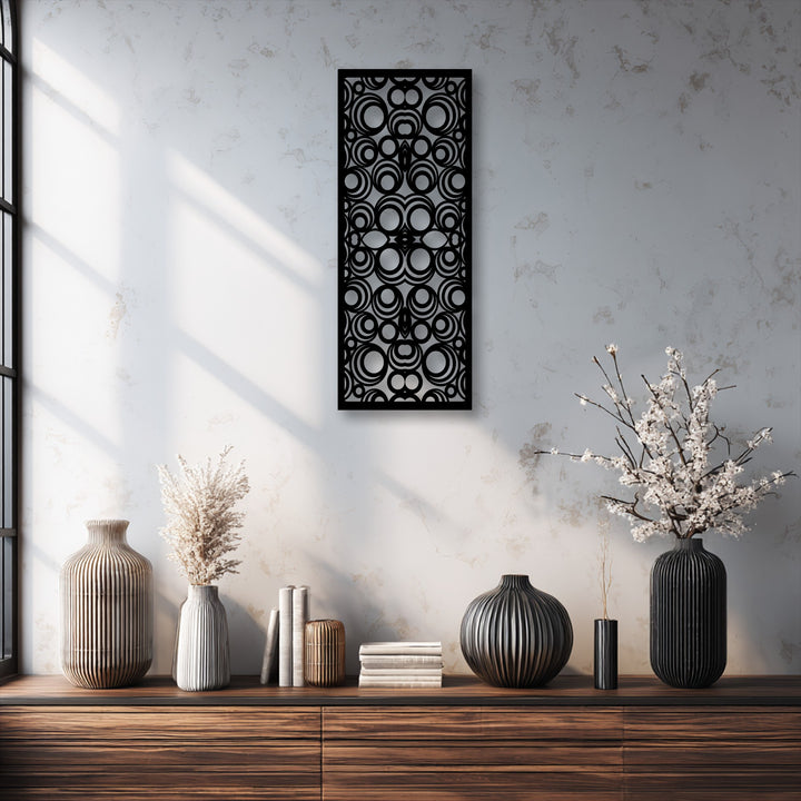 The high-quality black metal artwork features a modern geometric circle pattern, showcasing excellent craftsmanship.