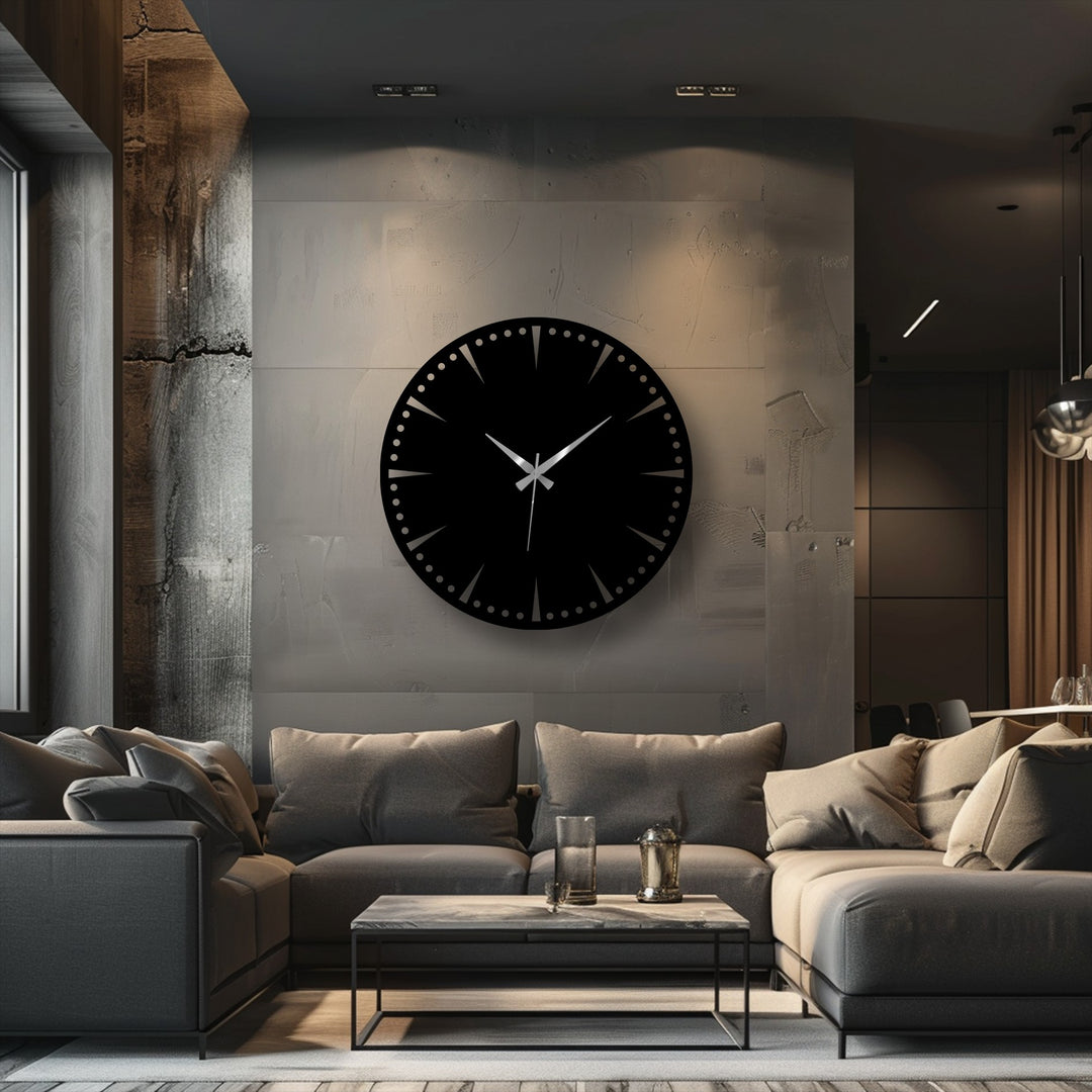 Horizontally oriented, round decorative metal art clock in black adds a minimalist touch to any room with its unique design and statement presence.