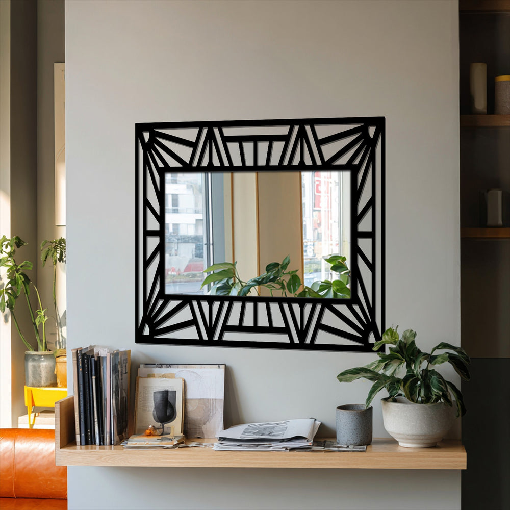 Angular black metal lines create a dynamic sense of movement around this geometric sunburst frame stained glass wall mirror.