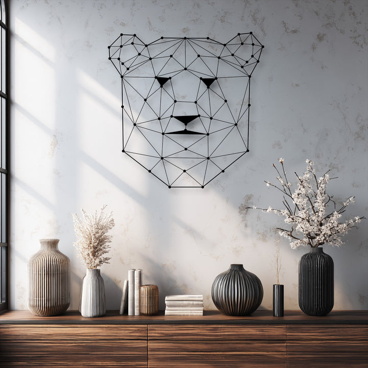 The delicate white cherry blossom branches, providing a soft touch to the decoration wall art display, contrast beautifully with the geometric bear face metal art.