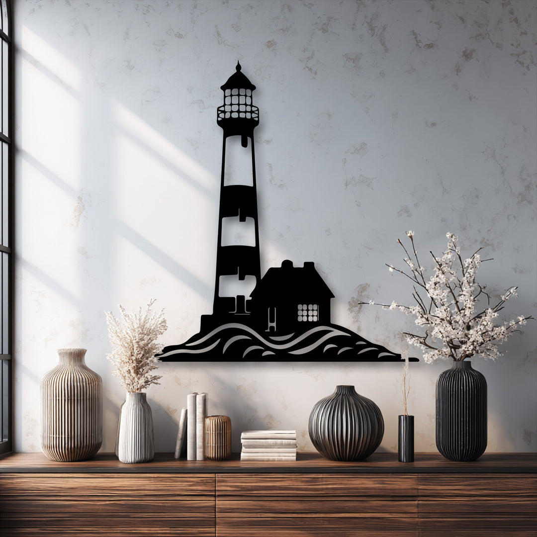 The distinct layers of the unique metal wall art show a coastal lighthouse silhouette, with subtle shadows adding depth to the ocean waves and house.