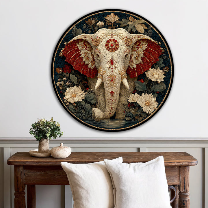 Warm color temperature highlights the intricate details of this sacred elephant oil painting artwork, set against a cooler, dark floral background in a round wood frame.
