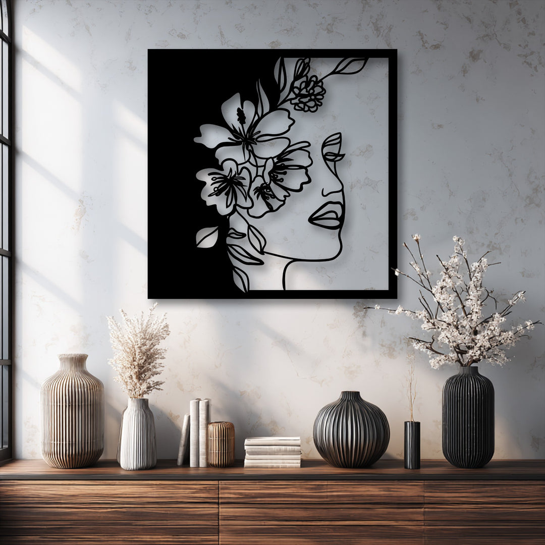Organic forms of delicate flowers and a woman's profile in minimalist line art create elegant decoration wall art.