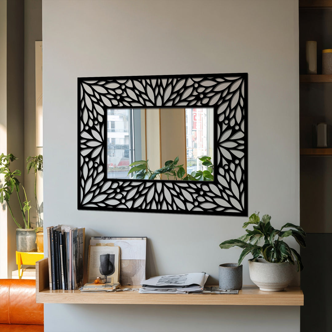 Organic forms define the intricate floral patterns of this metal artwork mirror, adding an elegant and decorative touch to its framed design.