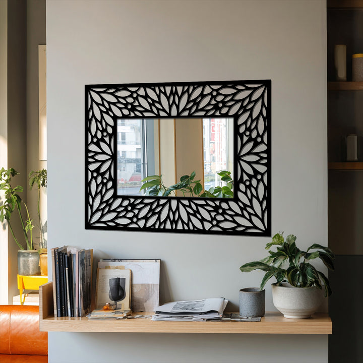 Organic forms define the intricate floral patterns of this metal artwork mirror, adding an elegant and decorative touch to its framed design.