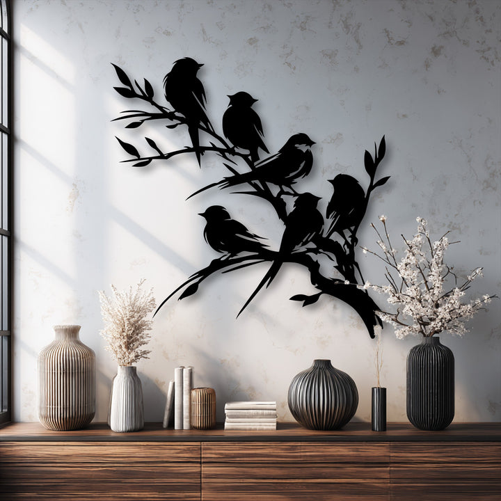 Exquisite metal artwork showcasing the precise laser-cut quality of birds perched on a branch, enhancing any space.