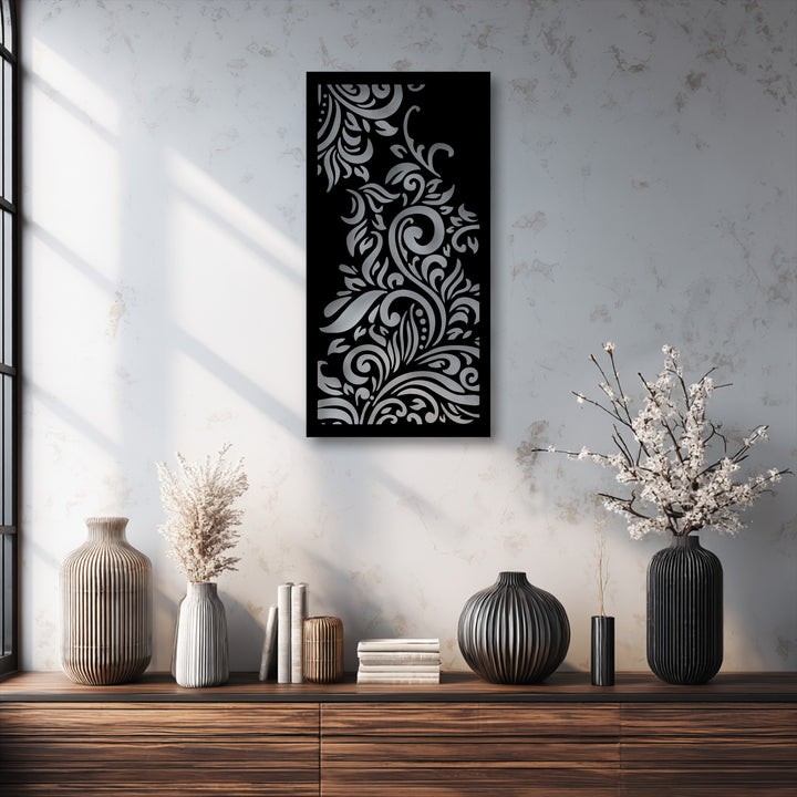The ornamental floral swirl decorative metal art creates a striking layering effect with its metallic cut-out design over a dark background.