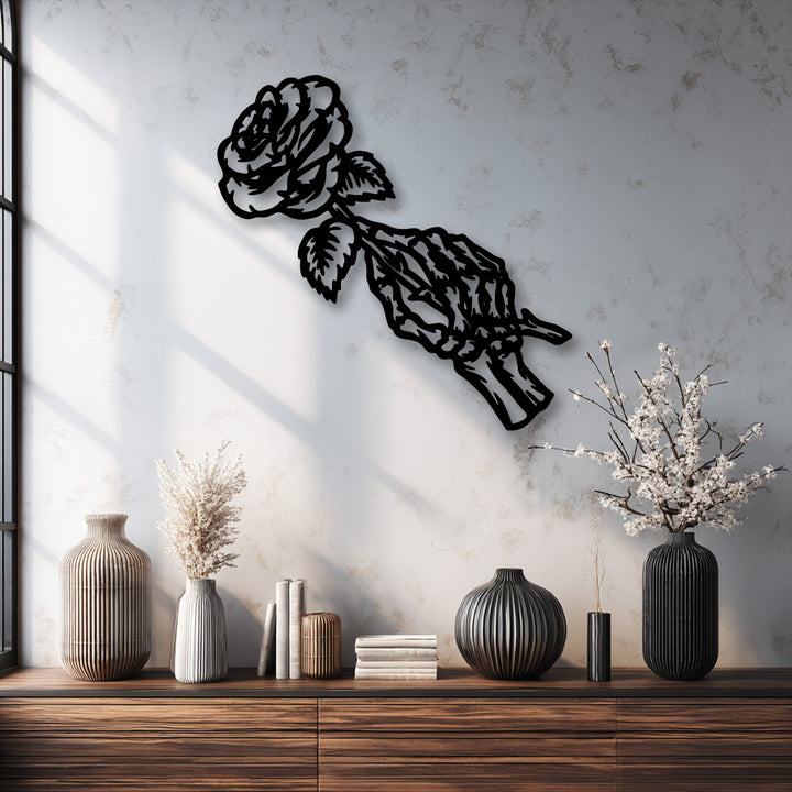 The brightly illuminated wall on the left, featuring sharp window shadows, draws attention to the unique Fading Rose Skeleton gothic metal art for wall.