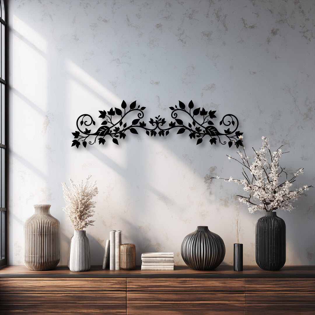 A captivating black floral vine unique metal wall art piece with elegant scroll designs adorns a textured wall.