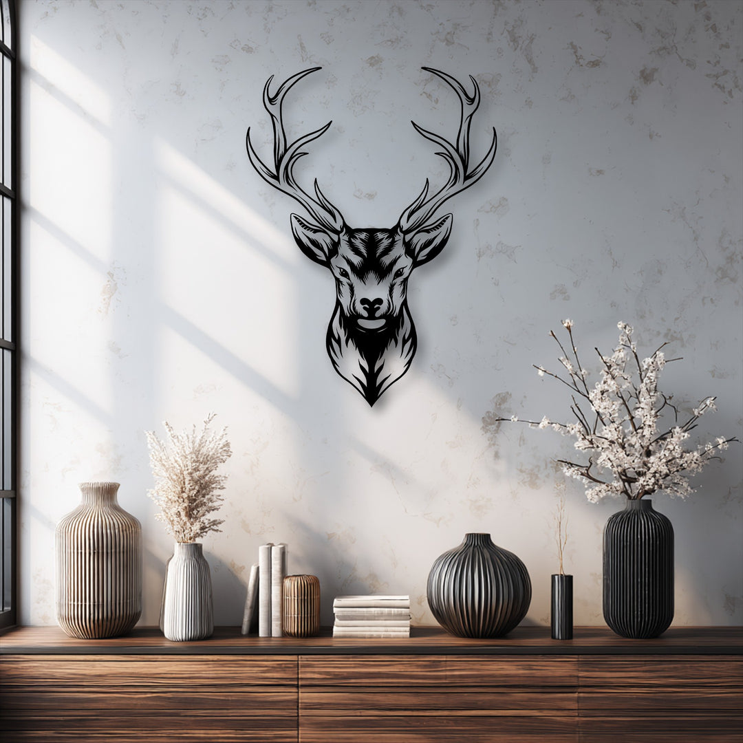 The striking, intricately detailed deer head metal artwork with majestic antlers stands out as the focal point on the textured wall.