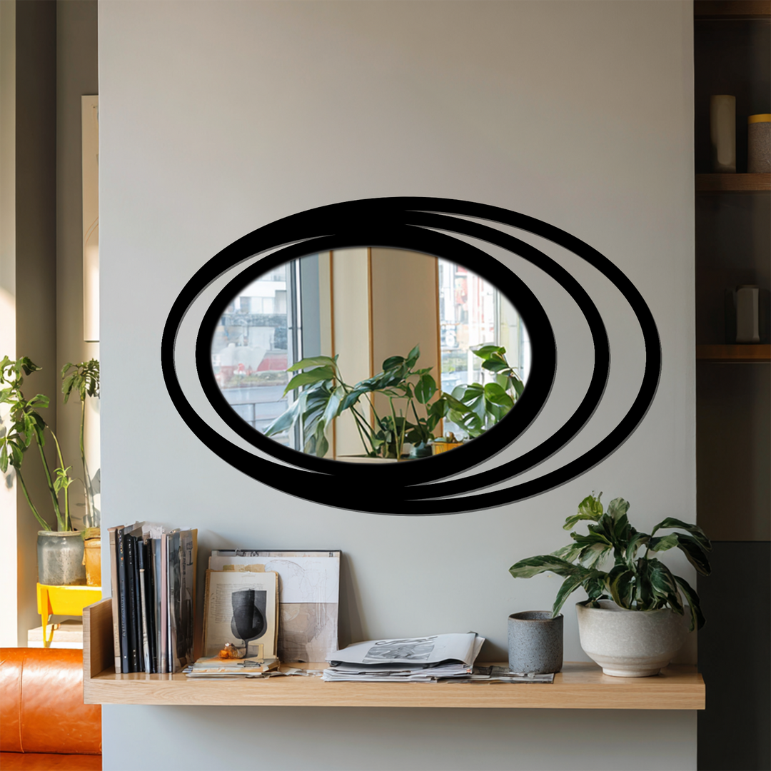 Displaying realistic detail, the Triple Halo Oval Wall Mirror presents a modern decorating with wall mirrors style through its layered frame in an interior setting.